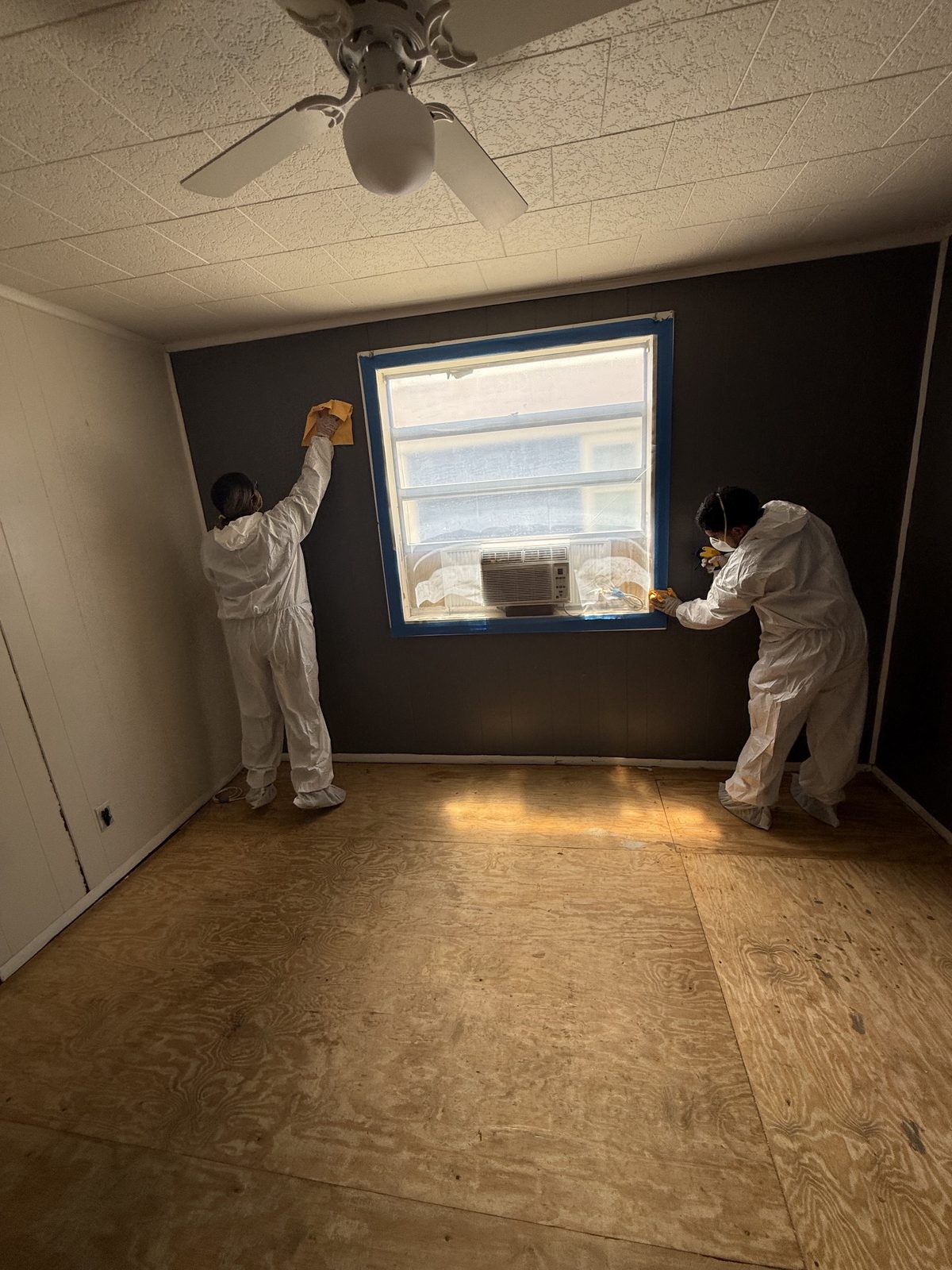 Kitchen with proper containment and drying equipment set up during water damage restoration