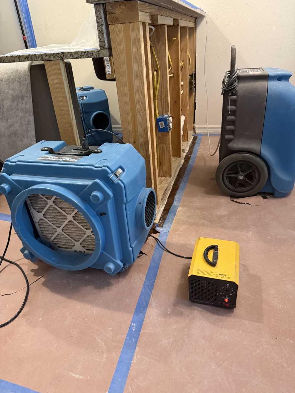 Air scrubbers and dehumidifiers running during commercial mold remediation drying