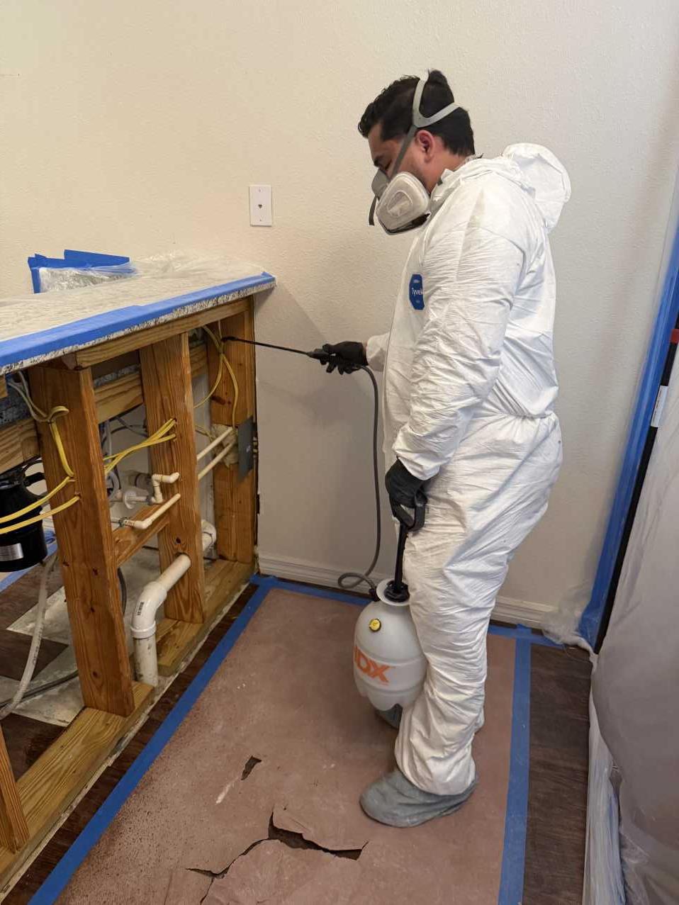 RFS technician applying antimicrobial treatment during commercial mold remediation