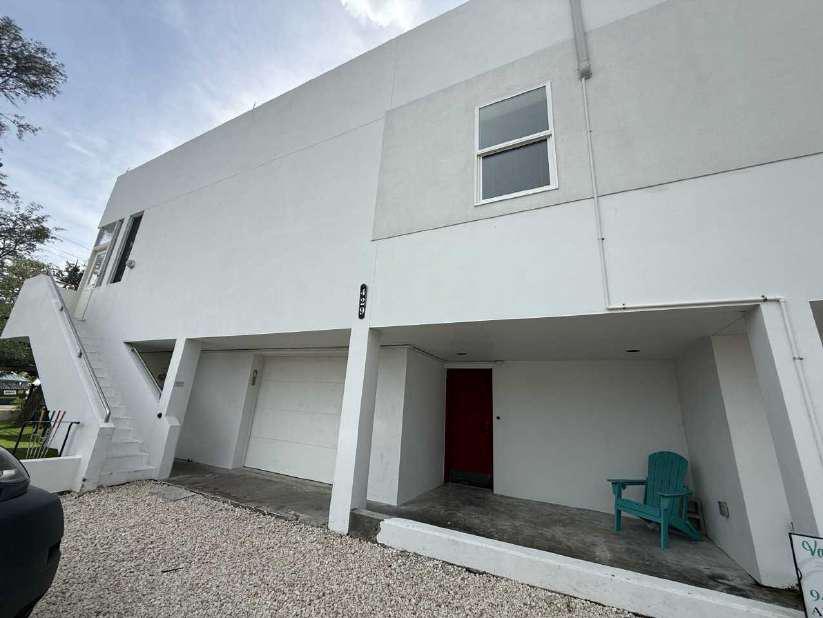 Coastal Florida commercial property exterior before emergency roof tarping