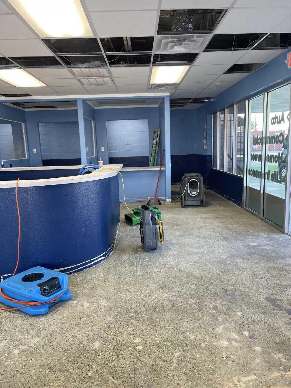 Commercial office space during final drying phase after storm damage restoration