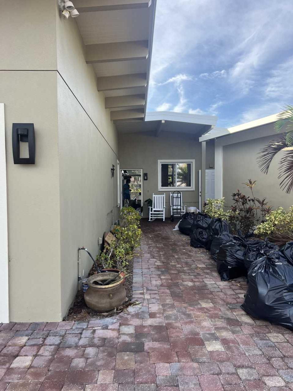 Storm debris bags outside a Tampa FL home after Hurricane Helene flooding