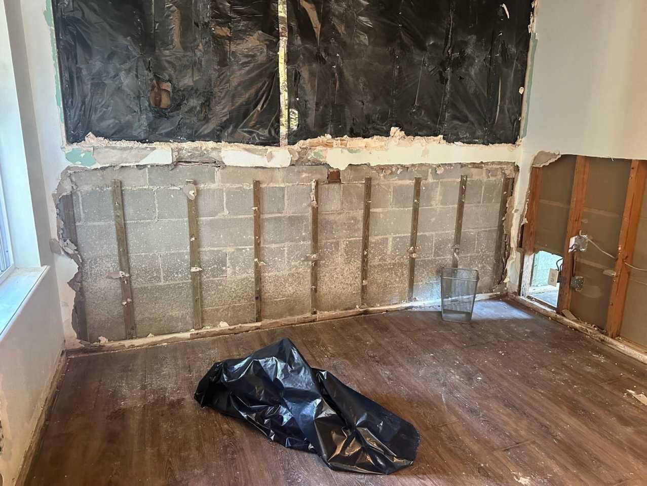 Additional wall opened up during flood cut demolition after hurricane flooding